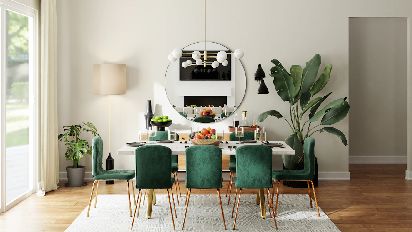 Dining area with green upholstered chairs and a round mirror